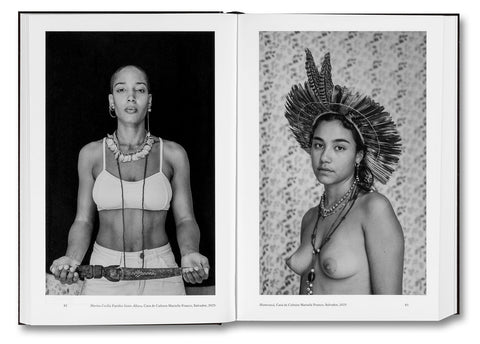 Open photography book "Faces and Phases" by MACK showing black-and-white portraits of diverse faces on a white background.
