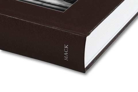 Close-up of the cover of Faces and Phases photography book by MACK, showcasing abstract portraits and detailed design elements.