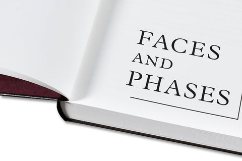 Close-up of the cover of Faces and Phases photography book by MACK, showcasing abstract face and phase illustrations.