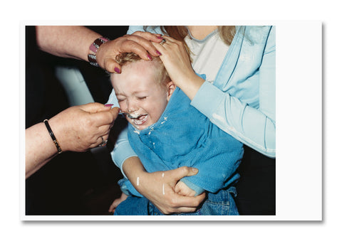 Open photography book titled "NH Family" by SPBH Editions, featuring black and white images and detailed photo layouts.
