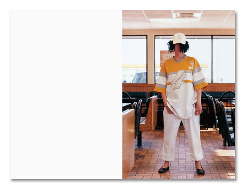 Person wearing a yellow and white outfit in a casual setting