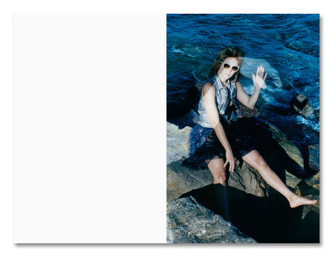 Open photography book titled "Positions" by MACK, showing a page with photographic images and text on a white background.