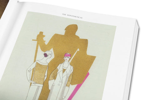 Close-up of the book "Prefigured: Fashion and Exhibition-Making" by SPBH Editions, showing detailed cover design and textured surface.