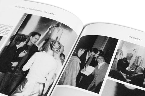Close-up of the "Prefigured: Fashion and Exhibition-Making" book by SPBH Editions, showing detailed page design and typography.
