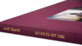 Close-up of the cover of "Red Eye to New York," a rare book by MACK featuring a detailed red and black design.