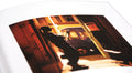 Close-up of the cover of the rare book "Red Eye to New York" by MACK, showcasing detailed red and black design elements.