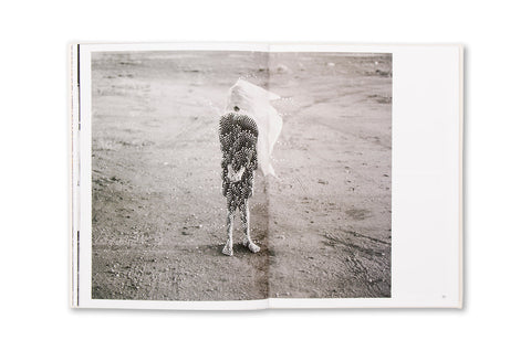 Photograph from the book "Restricted Images," featuring Warlpiri art and imagery, published by SPBH Editions in a photography book.