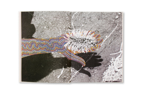 Photograph from the book "Restricted Images" by SPBH Editions, showcasing Warlpiri artwork from Central Australia.