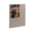 Open photography book "Hola Mi Amol" by SPBH Editions showing black and white images on glossy pages.