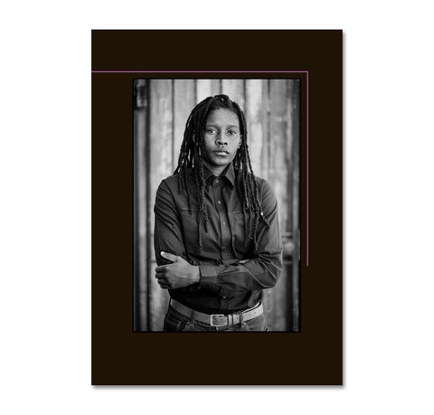 Portrait of a person with braided hair wearing a dark shirt, framed by a black border with pink lines. The cover for 'Faces and Phases'