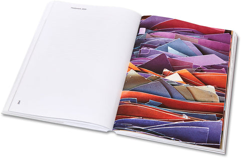 Open art book from House of Card by MACK featuring vibrant abstract artwork on glossy pages.